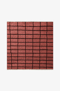 rust square wool rug with hand-drawn black grid lines, available in 6x6 and 8x8 sizes for modern living rooms