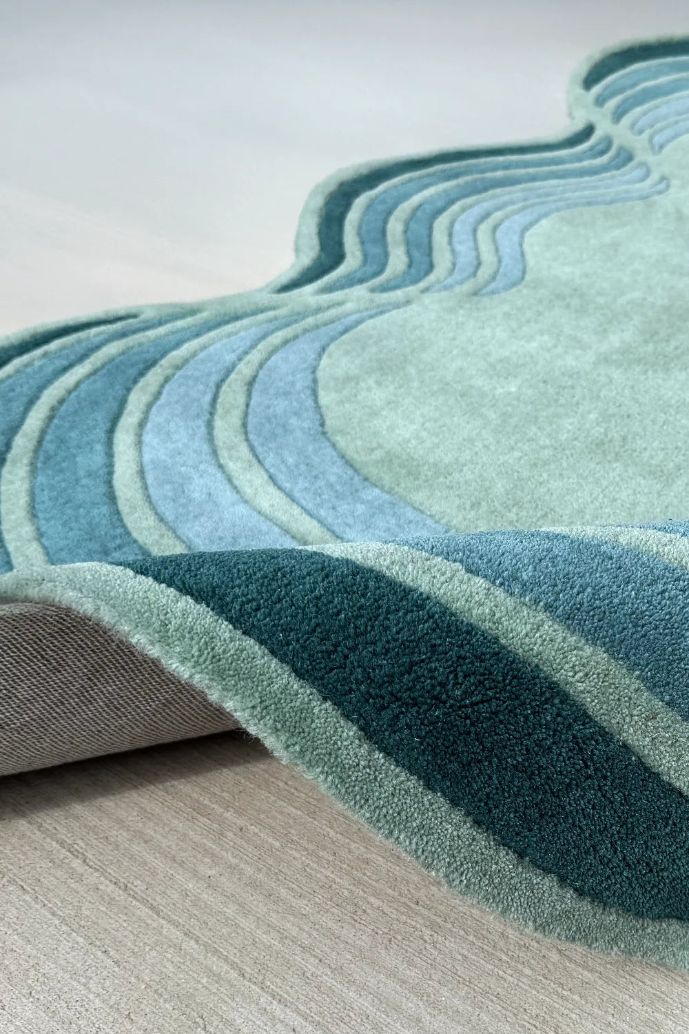 3x5 modern irregular wool rug in sage, teal, and aqua tones with wavy stripes for living room or kids bedroom