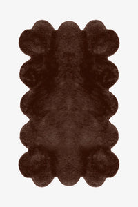 Rich brown scalloped modern wool rug, cozy boho bedroom rug with playful wavy edges