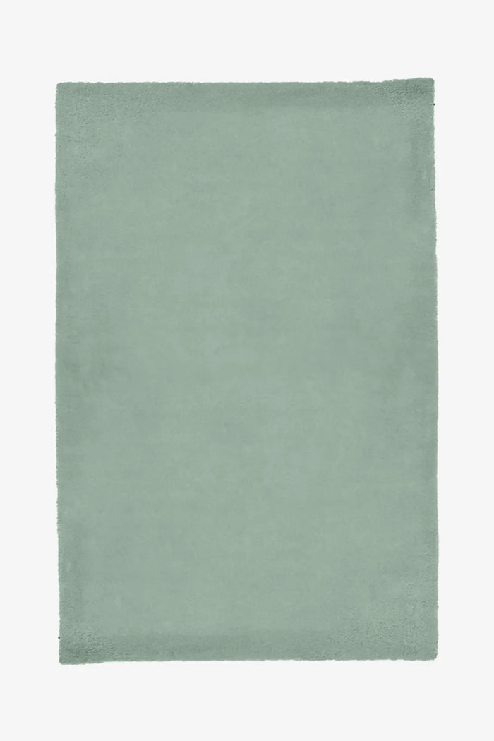 8x10 sage green wool area rug with plush hand-tufted pile, perfect as a modern minimalist rug for living rooms