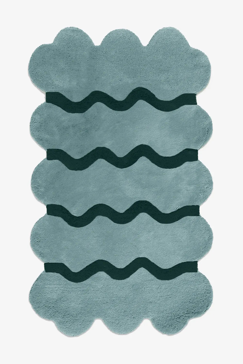 Contemporary blue scalloped edge wool rug with hand-carved wavy lines, shown in 5x7 size