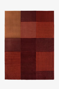 Burnt orange and deep red block pattern rug, boho modern wool rug for cozy living spaces and creative studios