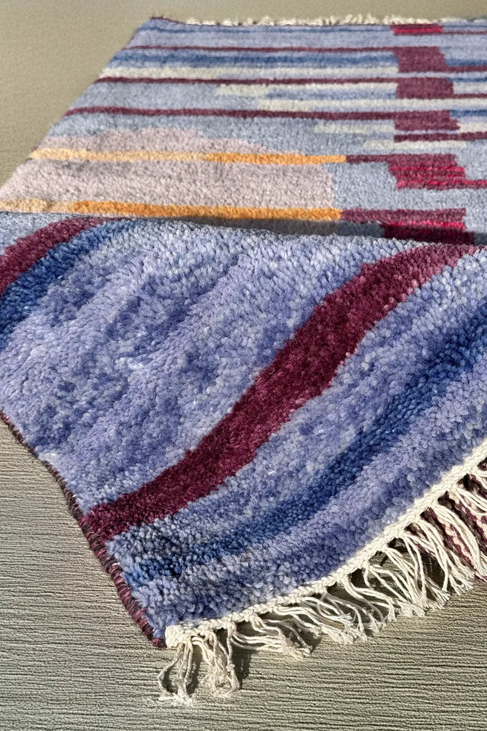 Luxury wool area rug with a modern geometric striped design