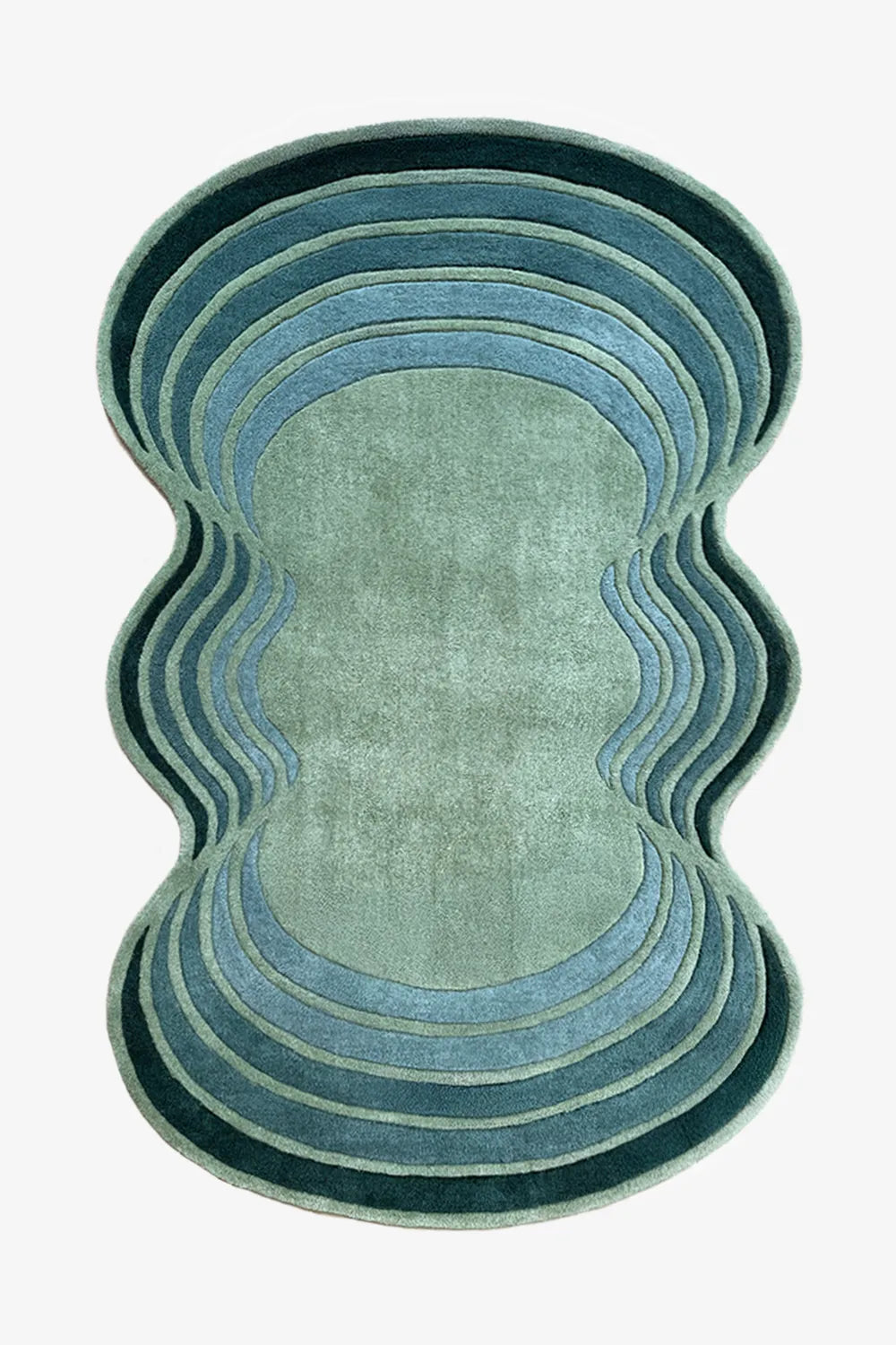 Blue and green wavy abstract rug with scalloped edges, a modern irregular shaped wool rug for colorful living rooms or bedrooms

