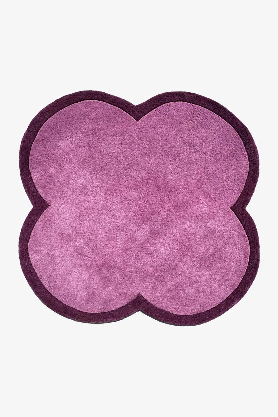 Purple flower-shaped rug with dark plum border – a funky, abstract shaped rug perfect for kids' rooms or colorful living rooms
