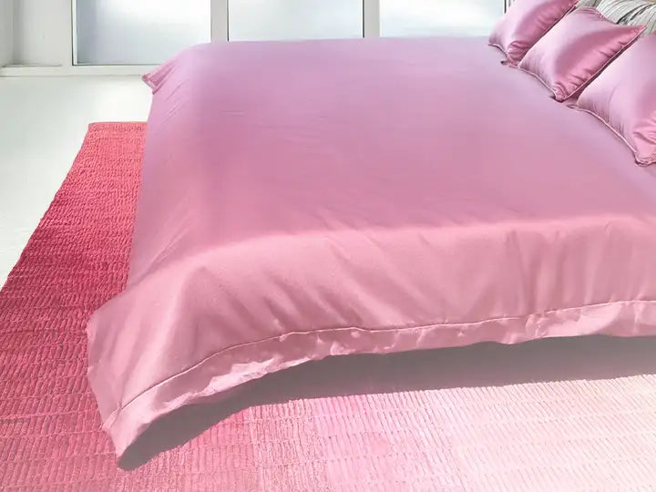 vibrant pink ombre wool area rug in a contemporary bedroom