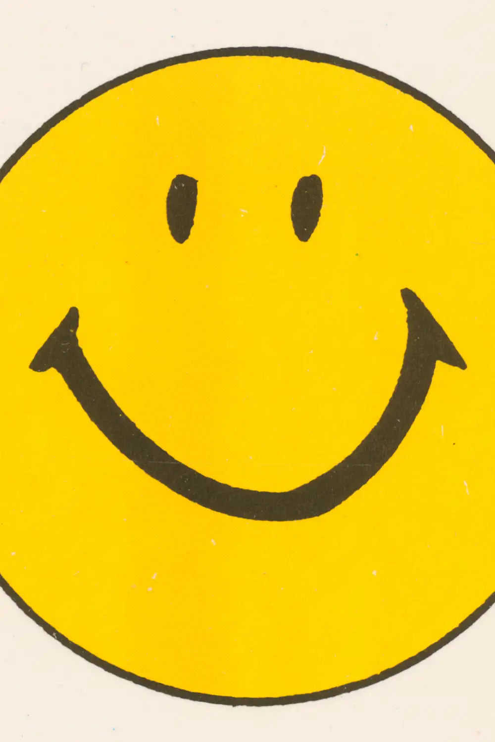 Retro-style yellow smiley face print for playful interiors
