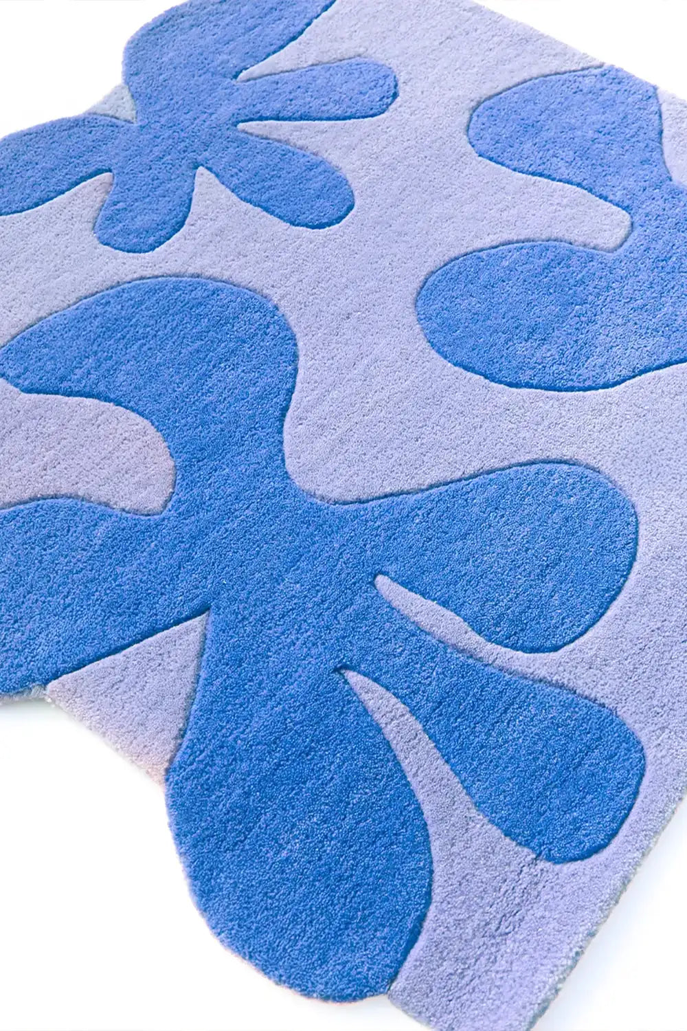 Blue and periwinkle floral tufted square rug with raised 3D shapes