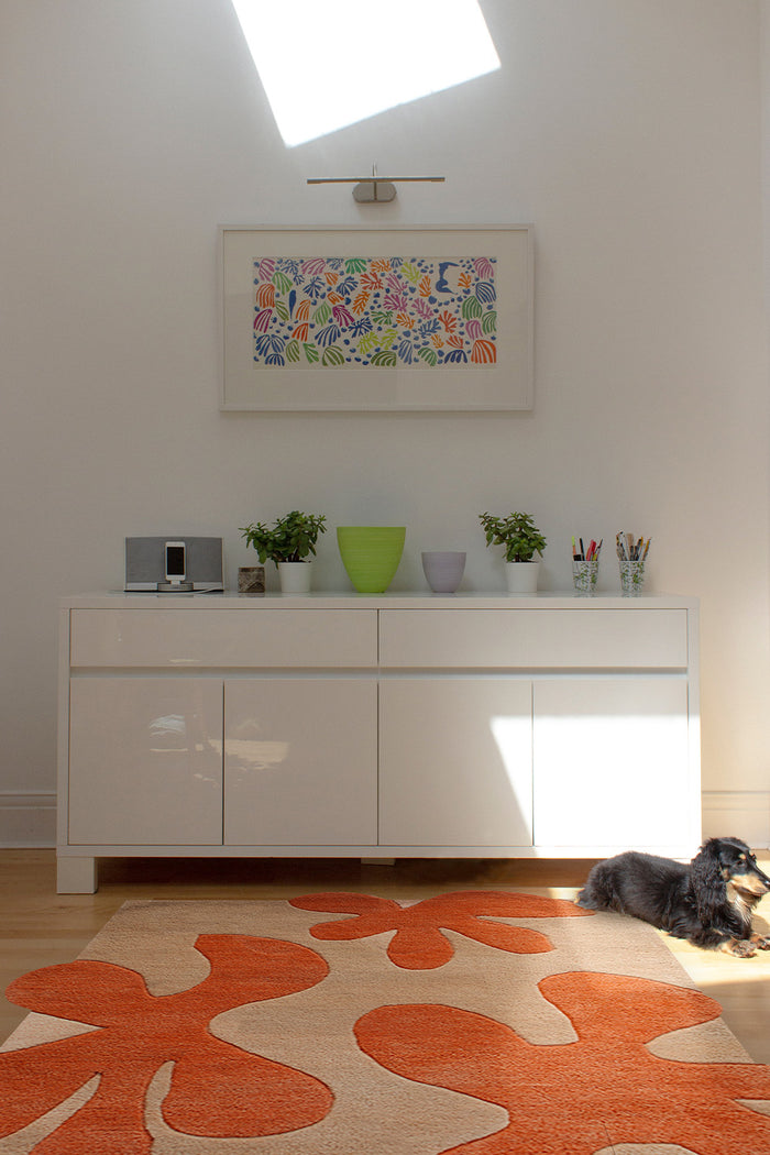 8x8 square rug styled in a bohemian-inspired living room lifestyle orange