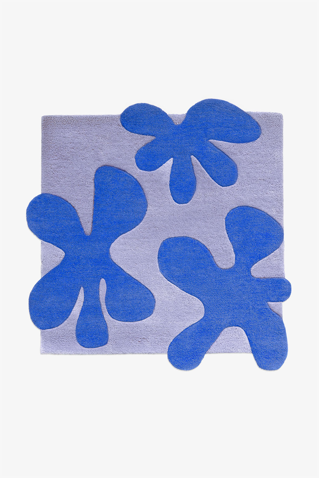 Square wool rug in two-tone blue with hand-tufted abstract flower forms