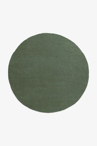 7x7 earthy forest green round wool rug perfect for cozy modern living rooms
