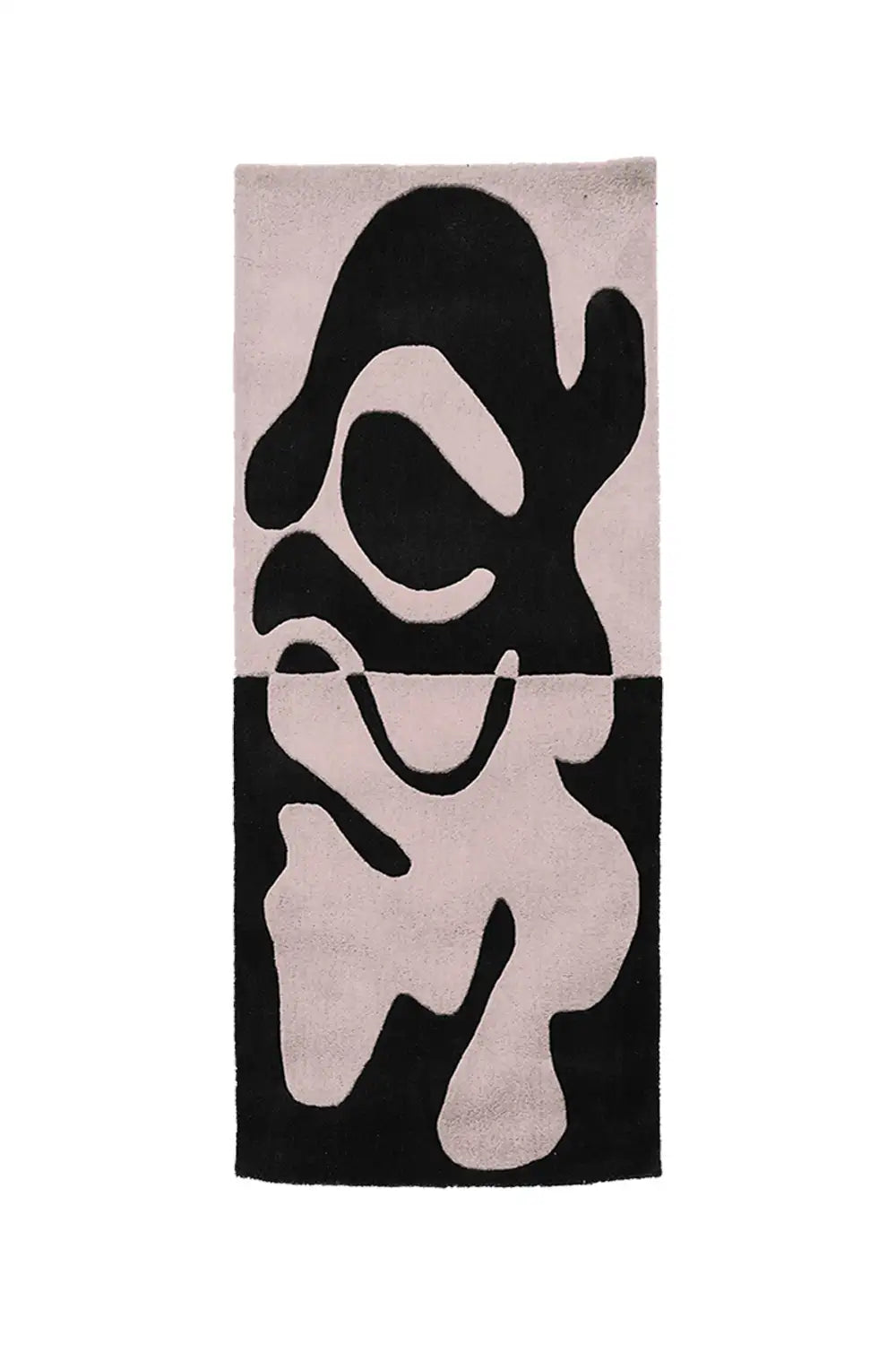 A bold wool runner rug with an eye-catching abstract design in classic black and crisp white