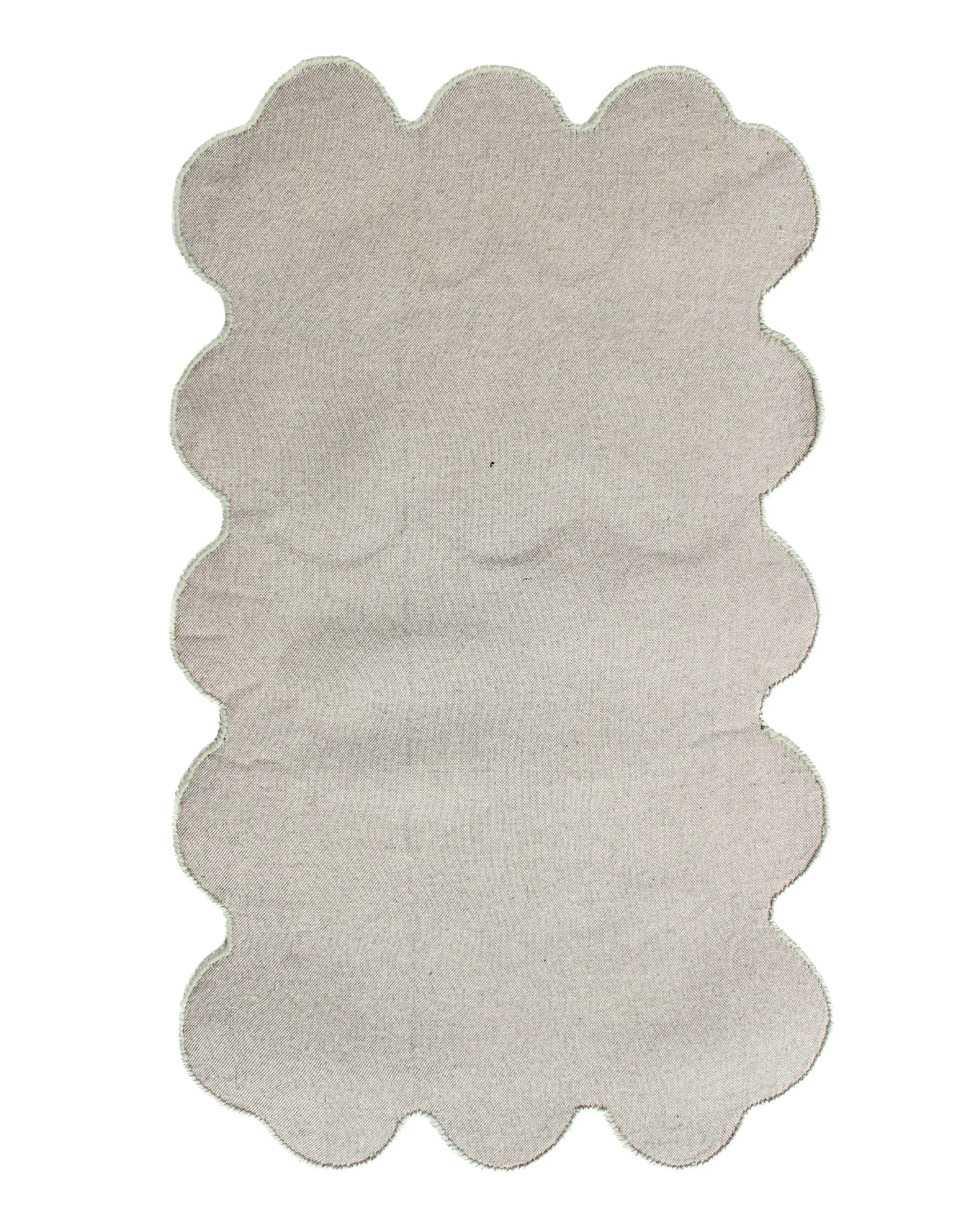 Back view showing the finishing around the unique sculpted edges of the Sculpted Edge Hand Tufted Wool Rug