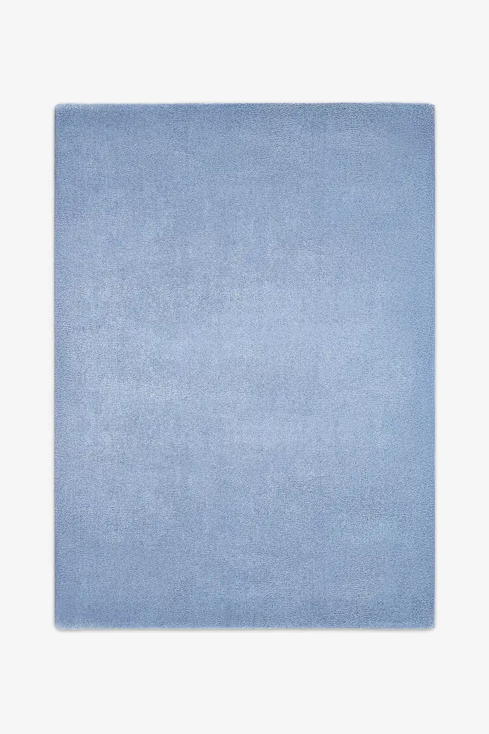 Soft light baby blue wool area rug sized 6x9, a serene option for modern living rooms, bedrooms, or nursery designs