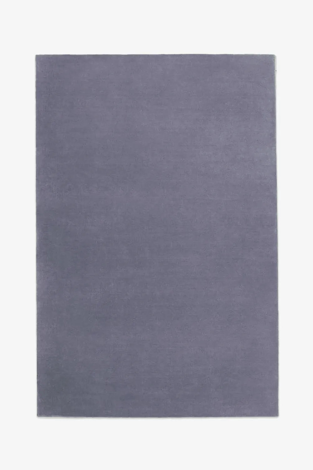 Dusty navy blue wool rug sized 6x9, a modern choice for cool bedrooms, living rooms, and dining areas