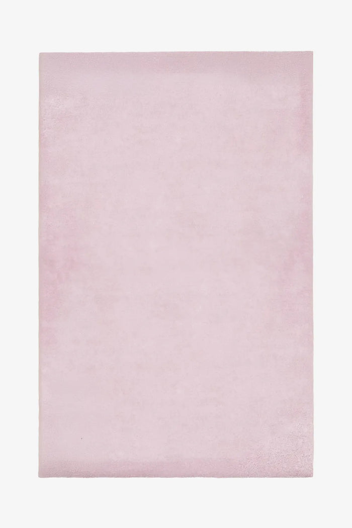 Blush light pink wool rug in 6x9 or 5x7 size, perfect for nursery rugs, bedroom rugs, or soft pastel modern interiors