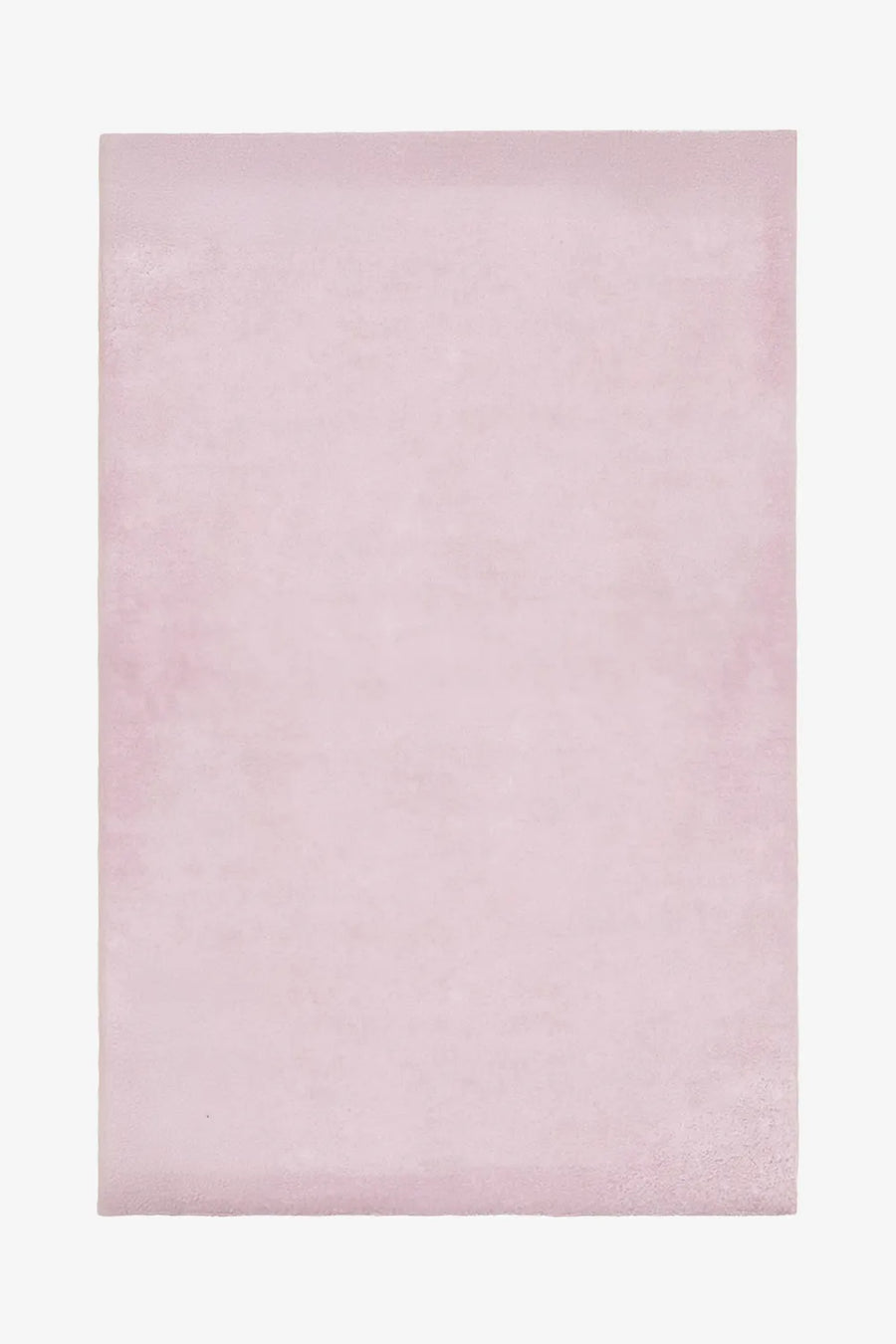 Blush pink wool rug in 6x9 or 5x7 size, perfect for nursery rugs, bedroom rugs, or soft pastel modern interiors