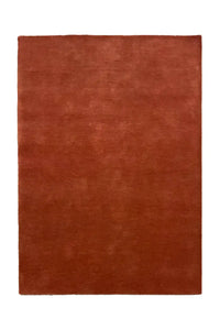 burnt orange wool area rug sized 5x8, a warm neutral choice for small dining rooms, bedrooms, or office spaces