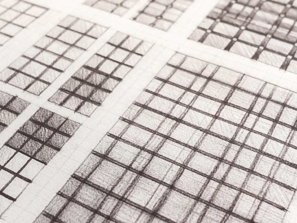 Pencil design sketches for the Kinetics I hand-tufted wool rug, showing overlapping grids of ruled squares shaded at different densities.