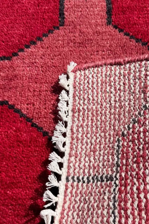 hand-knotted red wool rug