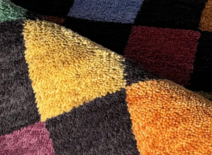 Multicolored textured rug with geometric pattern