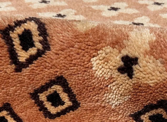 Close-up of a textured rug with geometric pattern