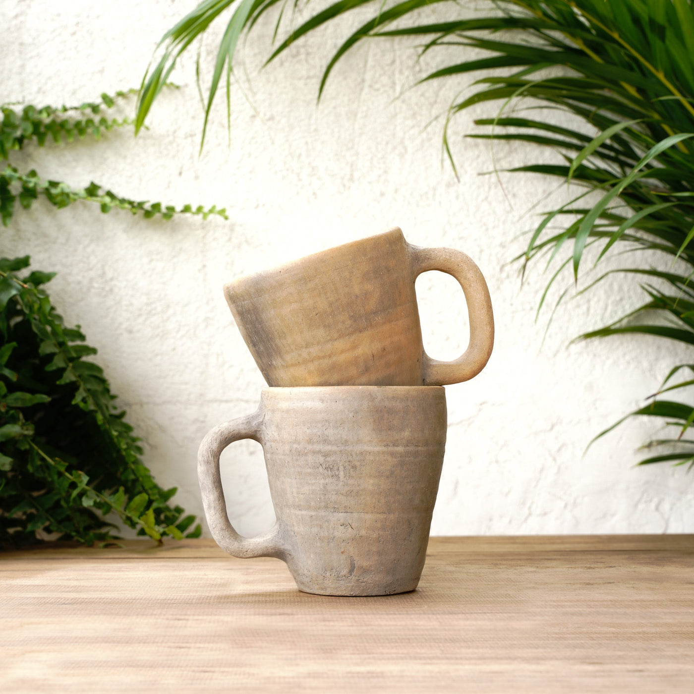 Artisan-crafted ceramic coffee mug with natural unglazed exterior texture