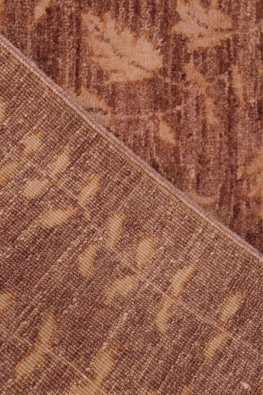 Handcrafted brown area rug made from high-quality New Zealand wool.