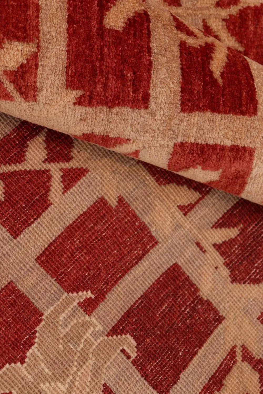 Classic wool rug featuring a red and brown nature-inspired design.