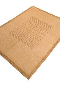 Angled view of minimalist tan wool area rug, shown in 9x12 and 10x14 sizing options, perfect for earthy living rooms and luxury bedrooms