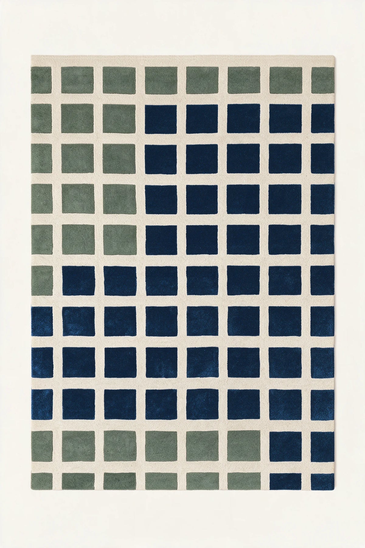a masonry hand-tufted wool rug in oat, sage and navy, shown flat from above