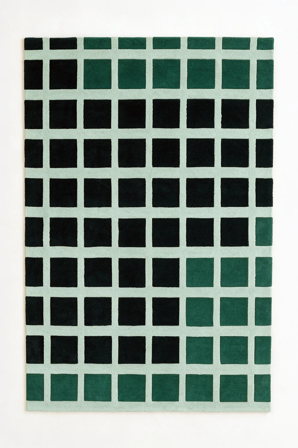 a masonry hand-tufted wool rug in pine, black and mist, shown flat from above