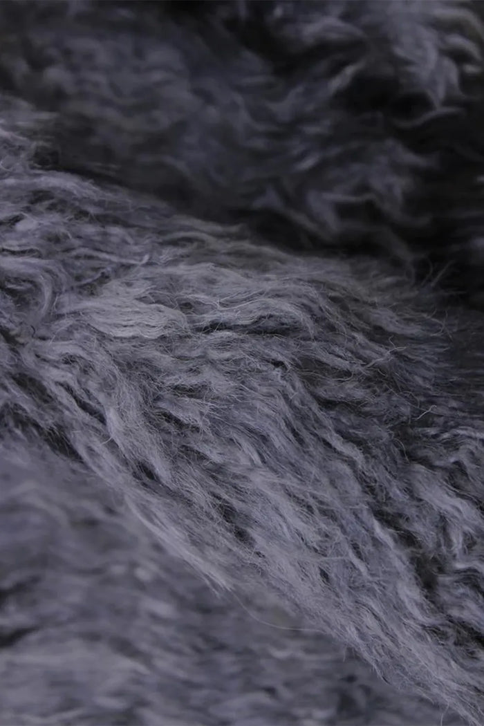 Close-up of plush charcoal gray shag wool runner, ideal for cozy hallway runner rug ideas, luxury entryway rugs, and boho floor runners