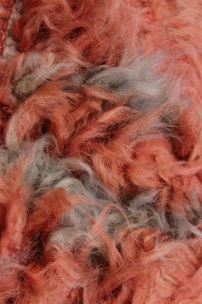 Close-up of thick wool shag texture blending burnt orange and gray tones, ideal for custom rugs and high-pile modern area rugs