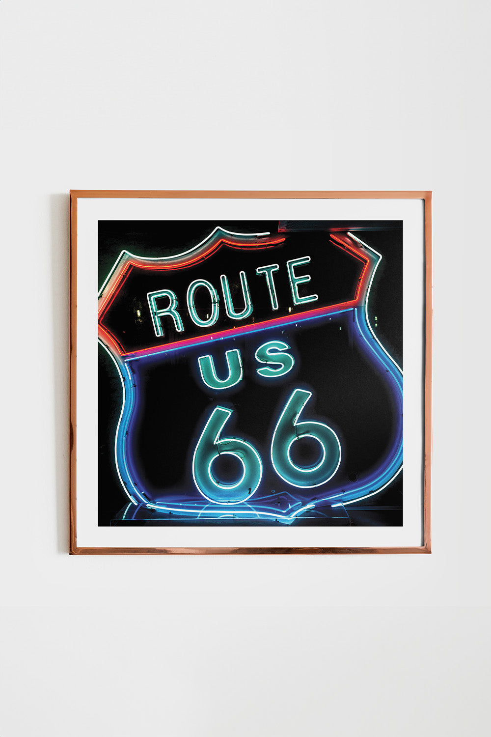 Square art print featuring a neon-style outline of the Route 66 sign against a bold black background.