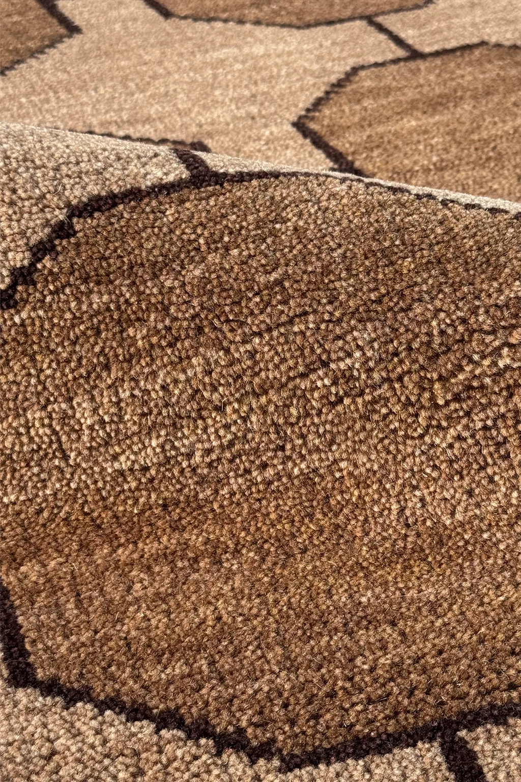 Close-up of a textured brown runner rug with geometric patterns
