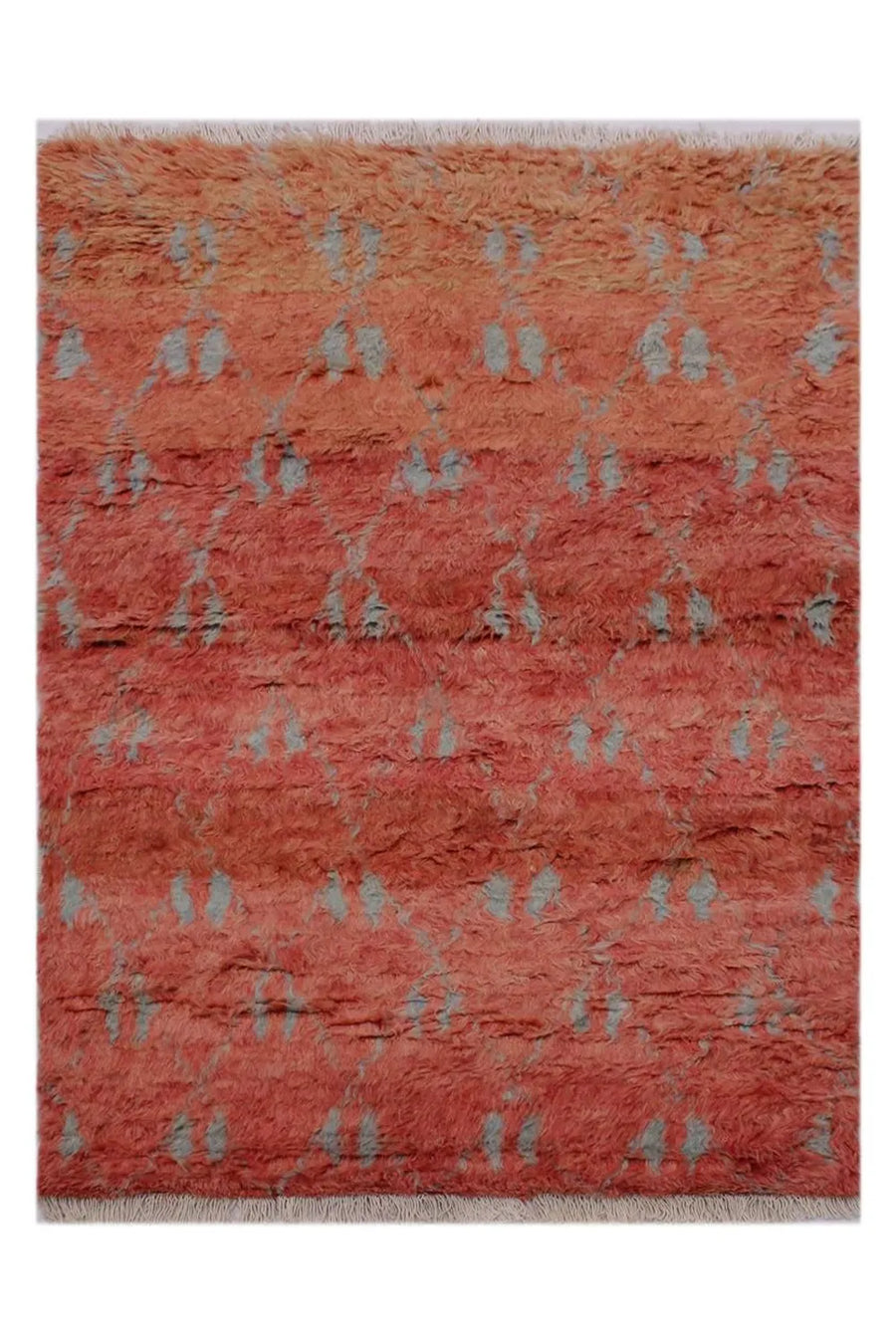 Plush terracotta orange shag rug with a subtle light gray diamond pattern.