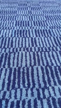 video showcasing blue striped plaid patterned wool rug by jubi rugs