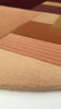 video showcasing hand tufted wool pile and earth tone design of modern sunset mosaic arched rug by jubi
