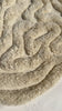tan shag rug with wavy irregular shape hand knotted in plush wool