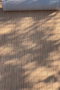 Modern funky rug in bold tropical colors placed underfoot in a bright sunlit space