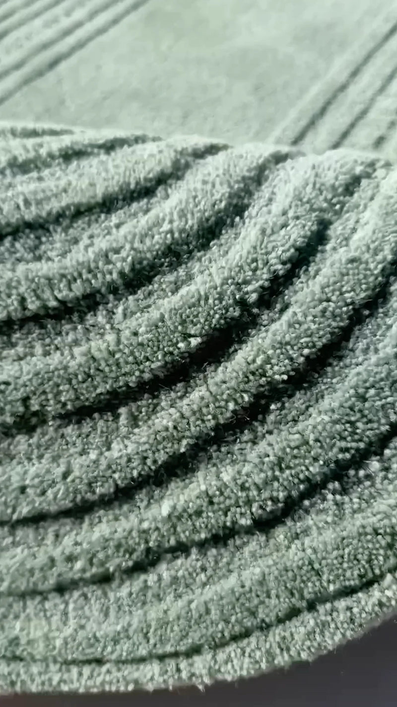 video showcasing hand tufted wool details of jubi's zen garden modern tufted rug in sage green