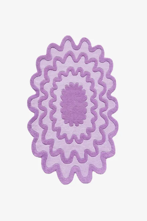 purple rug with scalloped wavy oval shape