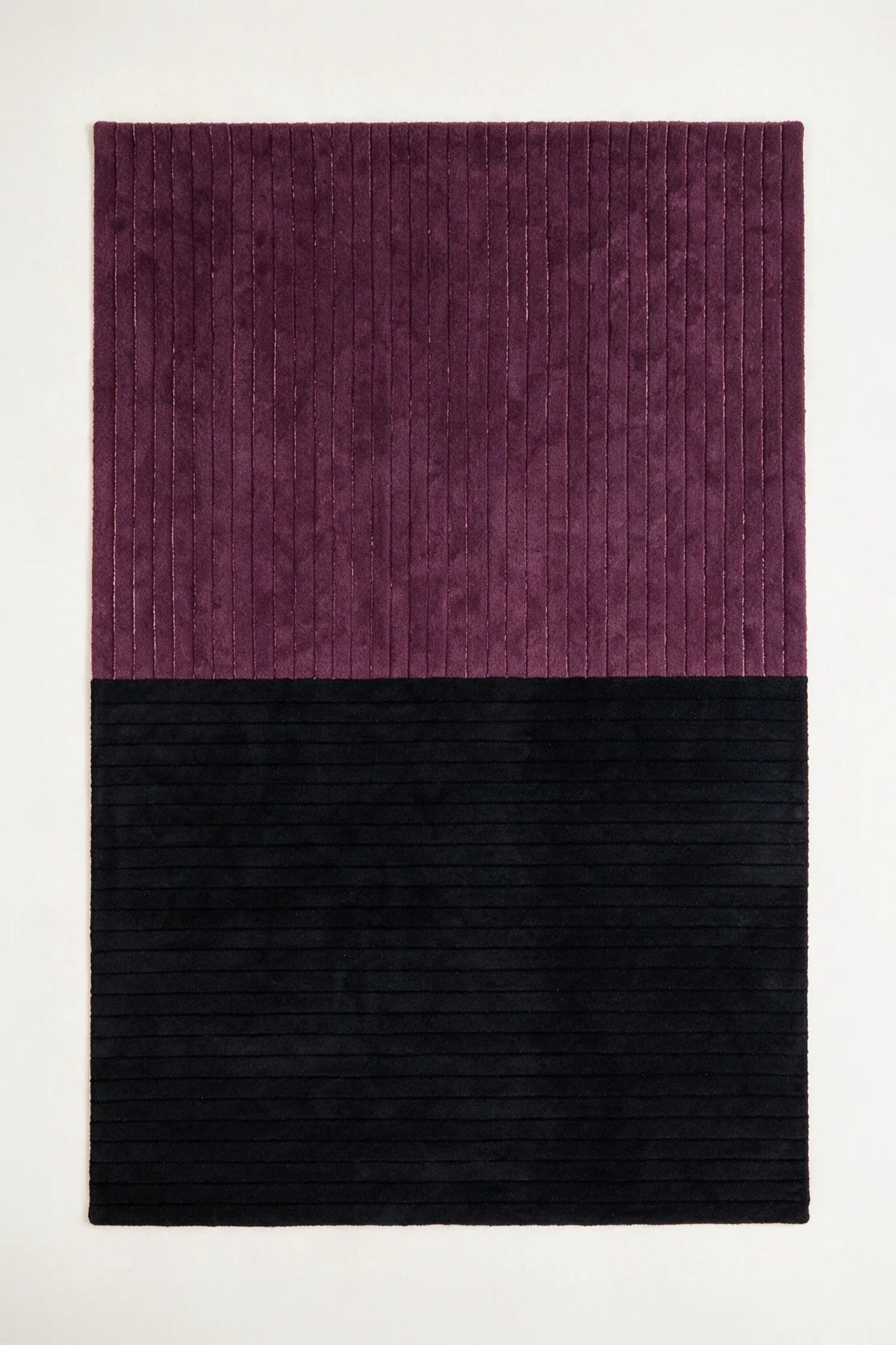 a ridge duo hand-tufted wool rug in purple and black, shown flat from above