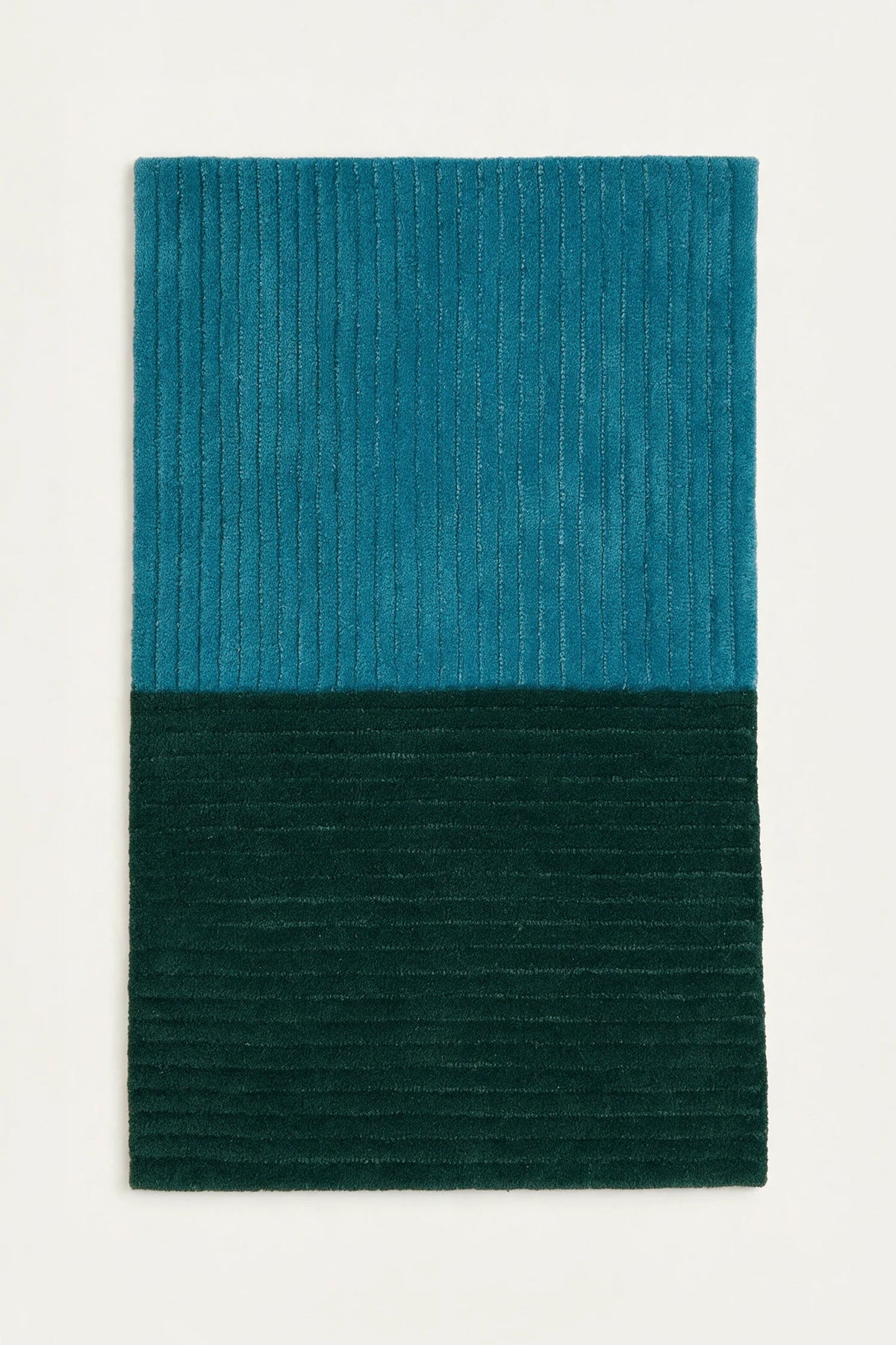 a 2 by 3 foot sample of a ridge duo hand-tufted wool rug in teal and forest