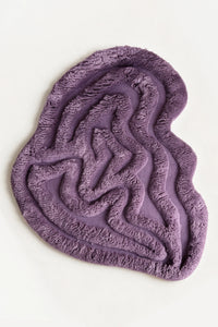 a rolling tides shag hand-knotted wool rug in lavender, shown flat from above