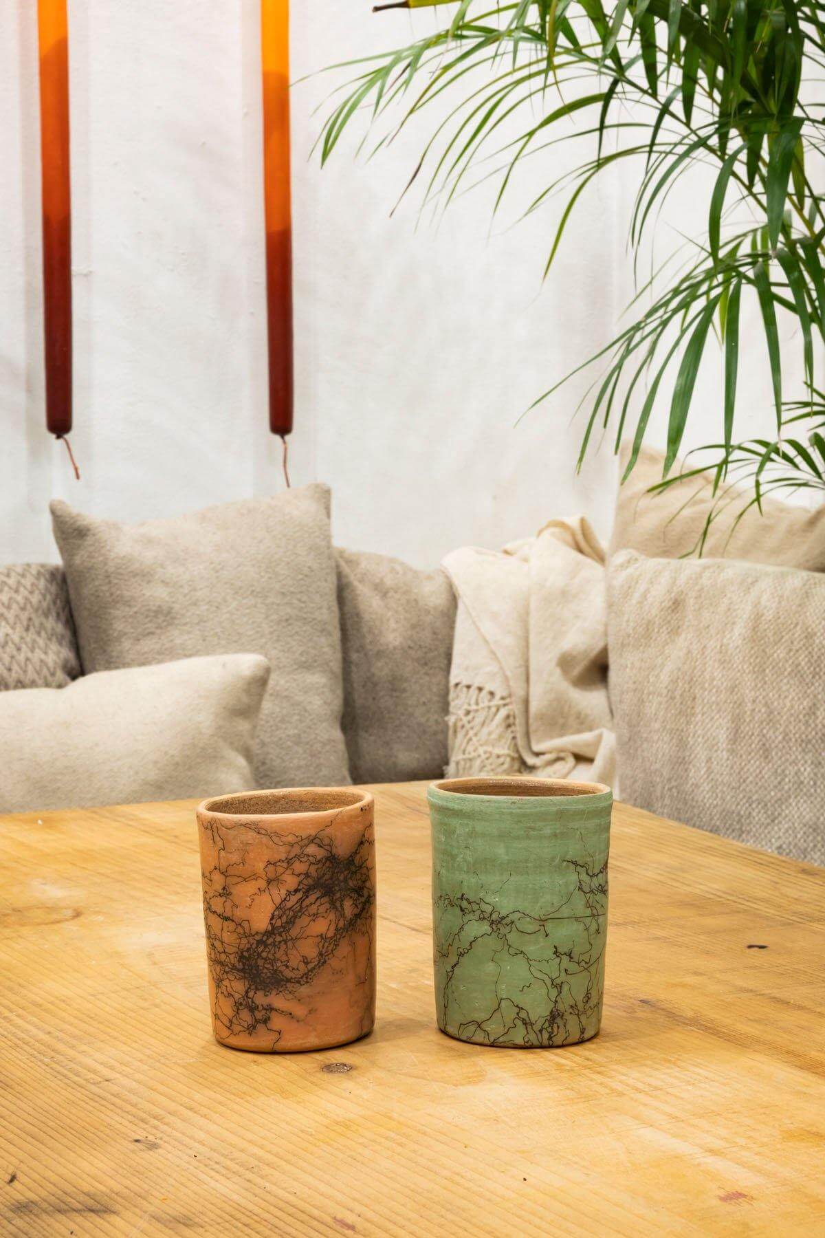 Raku Ceramic Mug on display, highlighting its use as a functional cup or vase.