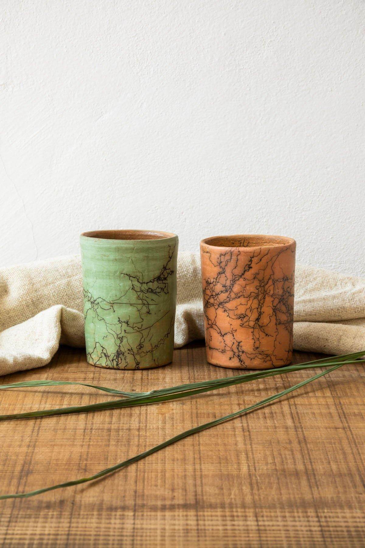Pair of Handmade Raku Mugs in Salmon and Sage, demonstrating color options.