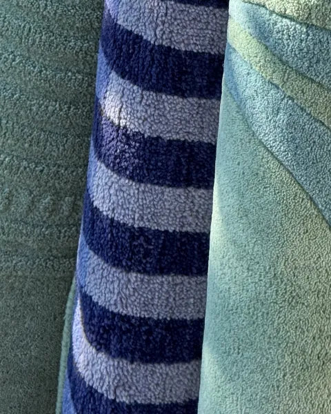 Close-up of blue and green rugs