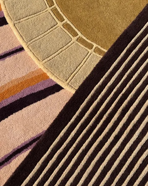 Close-up of textured rugs with geometric patterns
